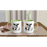 In My Fantasy Era white 11oz ceramic mug with green interior, perfect for coffee or hot beverages on a cozy table.