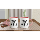 Two 11oz white ceramic mugs with pink interior, featuring fantasy-themed prints, perfect for coffee or hot beverages.