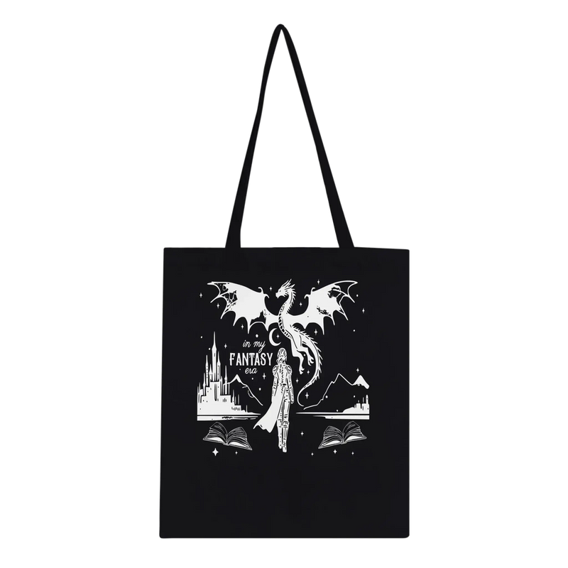 Black tote bag featuring fantasy art with a dragon, castle, and books, perfect for eco-conscious on-the-go use.