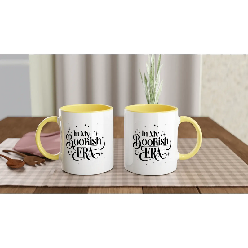 In My Bookish Era 11oz ceramic mug with yellow interior, perfect for coffee or hot beverages, dishwasher and microwave safe.